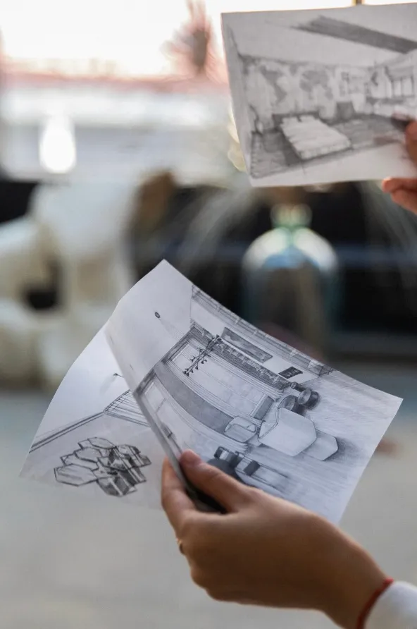Hand holding a hand-drawn interior elevation